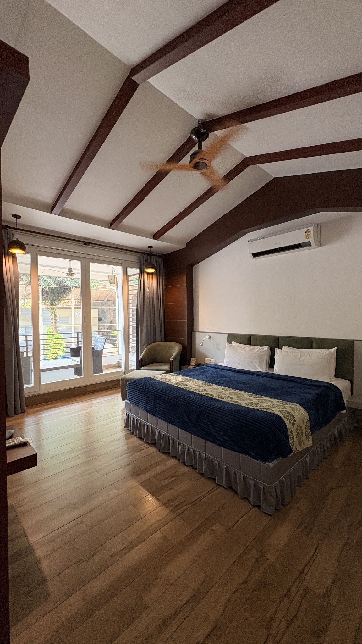 Super Deluxe Room bedroom at Aarian Woods Resort
